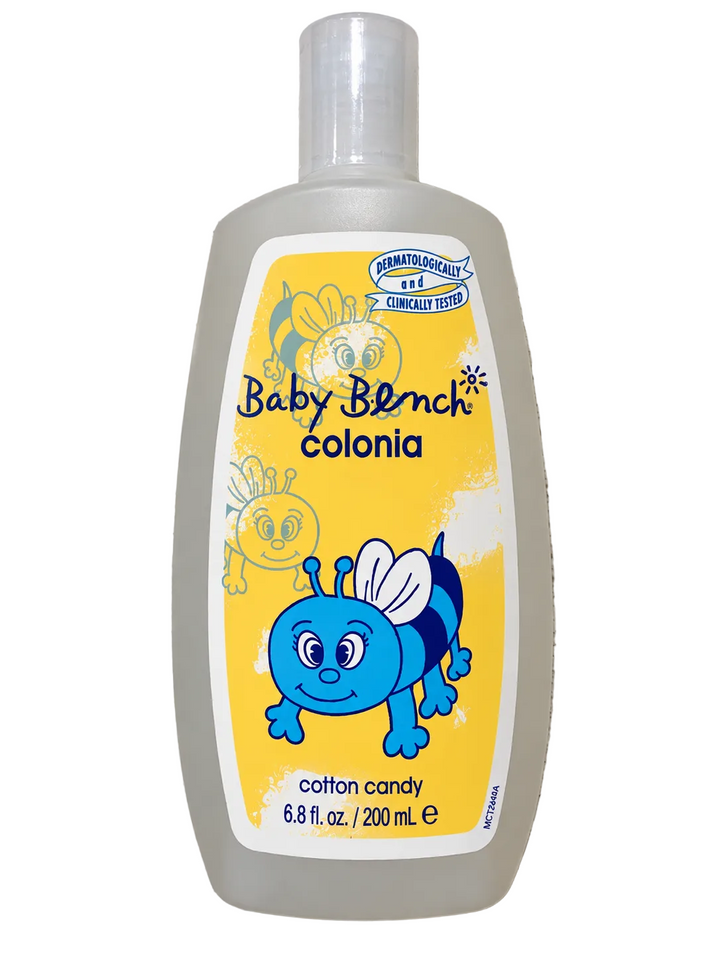 Front view of Baby Bench Cotton Candy Colonia 200mL (6.8 fl oz.) in a translucent white bottle with a clear cap, featuring a yellow label, blue cartoon bee illustration, and dermatologically and clinically tested seal.
