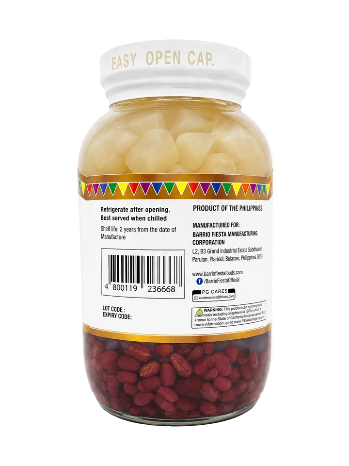 Back view of a glass jar of Barrio Fiesta Manufacturing Corporation Red Beans, showing the white label, barcode, and the red beans visible through the clear glass.