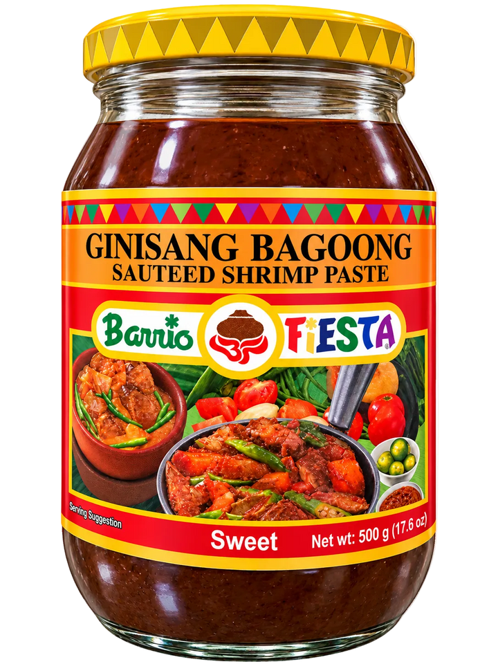 Barrio Fiesta Ginisang Bagoong Sweet Sautéed Shrimp Paste, 500g (17.6 oz), in a glass jar with a yellow lid and colorful red and orange label. Filipino shrimp paste condiment.