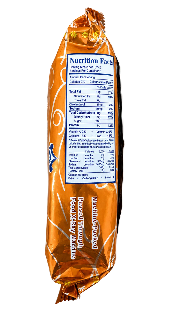 An orange and gold foil-wrapped packaged food item shown upright against a plain white background, with the Nutrition Facts label facing forward. Visible text includes 'Machine-Packed' and 'Pass Through Products.