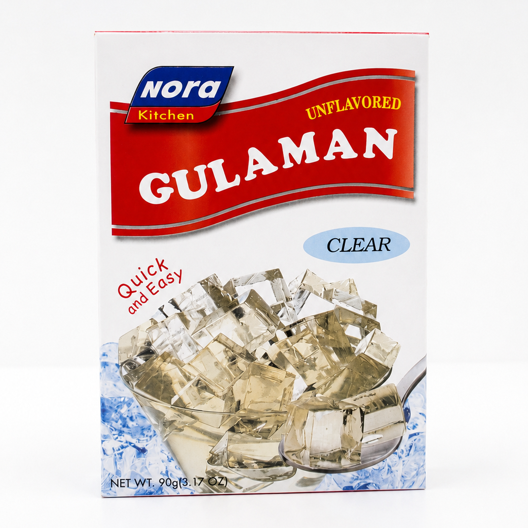 Front view of Nora Kitchen Unflavored Gulaman Clear jelly powder mix in a 90 g box. The package features the Nora Kitchen logo, a red "Gulaman" banner, "Clear" label, and a bowl of clear jelly cubes on a bright white background.
