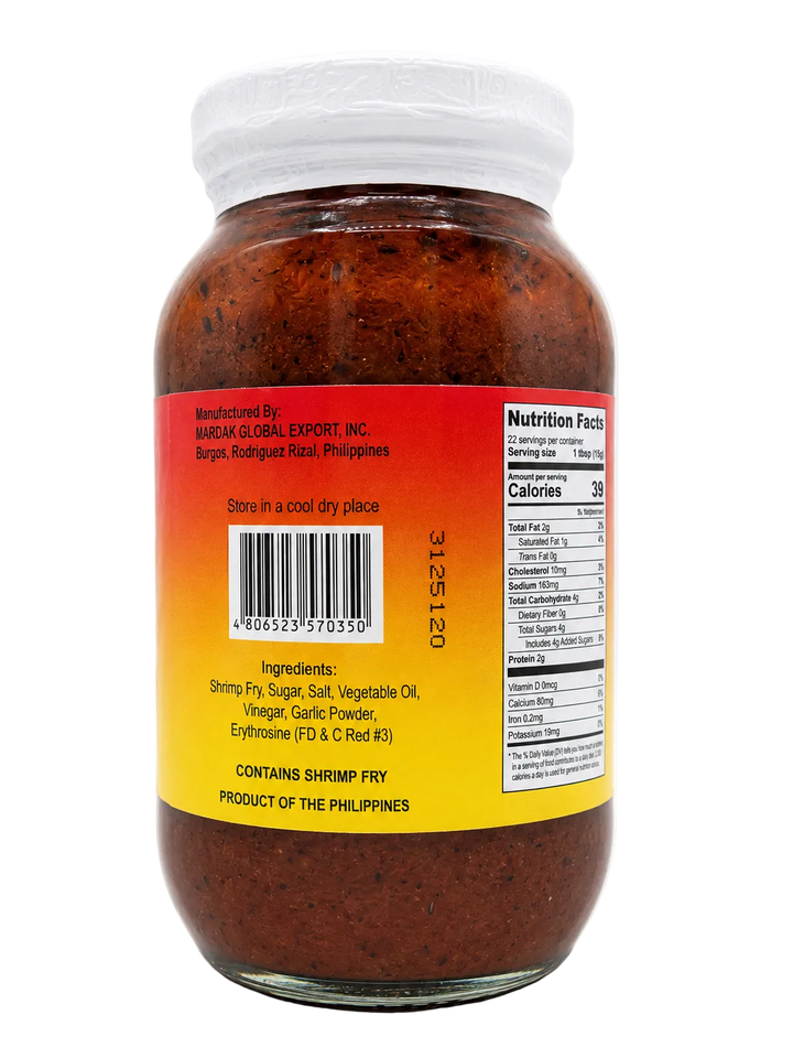 Pacific Isles Sauteed Shrimp Fry 340g (12 oz) glass jar, back view showing ingredients, barcode, storage instructions, manufacturer information, and product details.