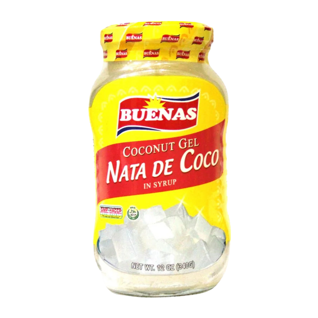 A glass jar of Buenas Nata de Coco Coconut Gel in syrup, featuring a bright yellow label with red and white branding and a yellow foil lid, isolated on a transparent background.