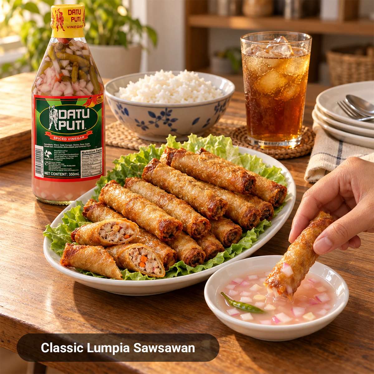 Lumpiang shanghai dipped in Datu Puti Spiced Vinegar with onion, chili, and garlic as a Filipino sawsawan