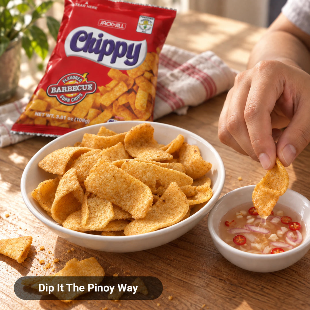 Jack 'n Jill Chippy BBQ Corn Chips in a bowl, hand dipping a chip into spiced vinegar with chili and onion, Dip It The Pinoy Way