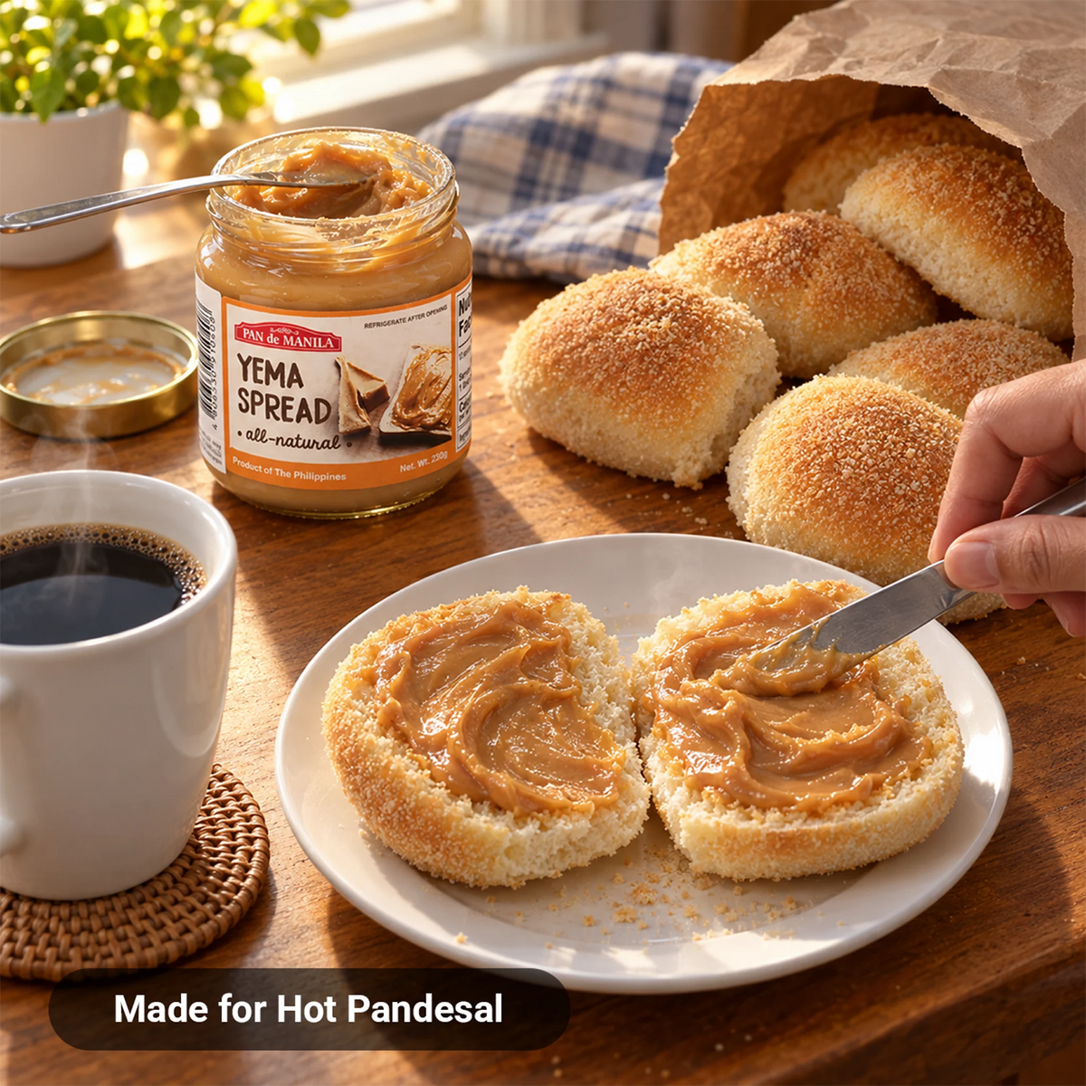 Pan de Manila Yema Spread spread on warm pandesal with a cup of coffee for a Filipino breakfast