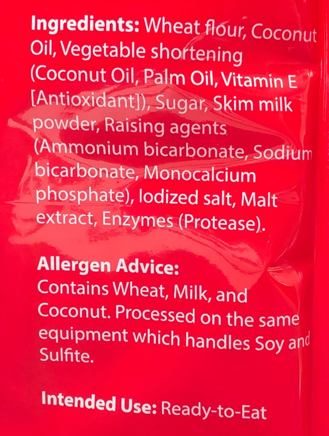 Red ingredient label with white text on a red background