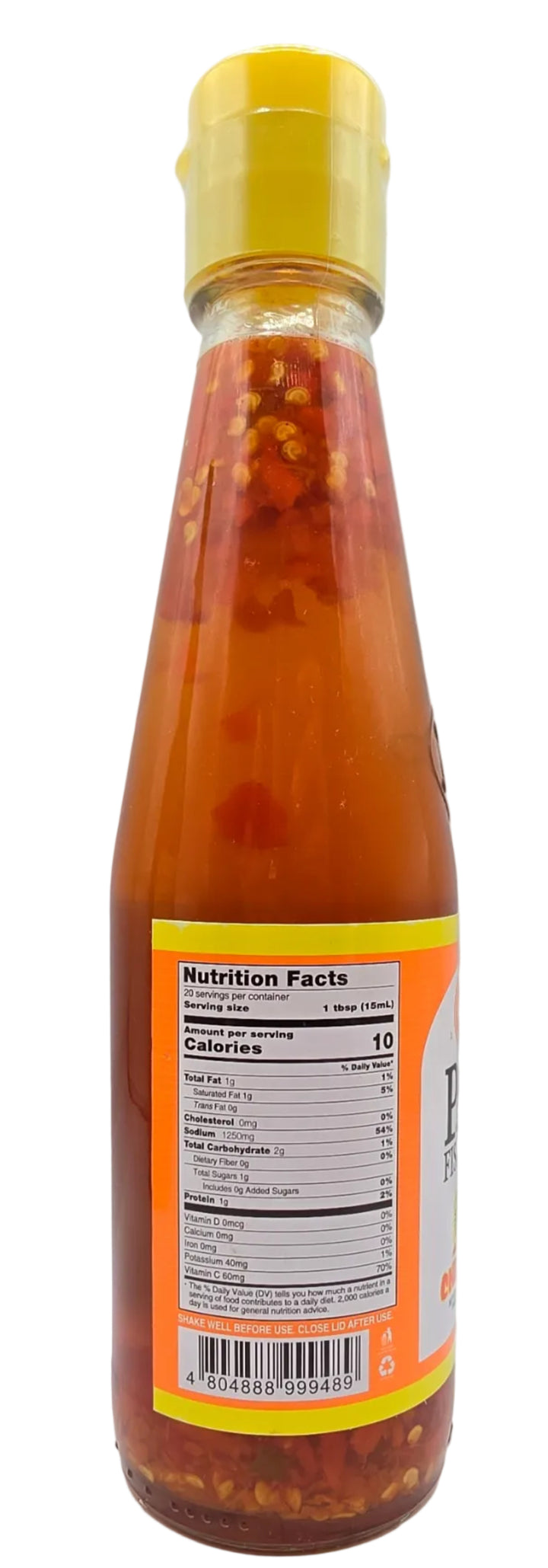 Bottle of hot sauce with a yellow cap on a white background