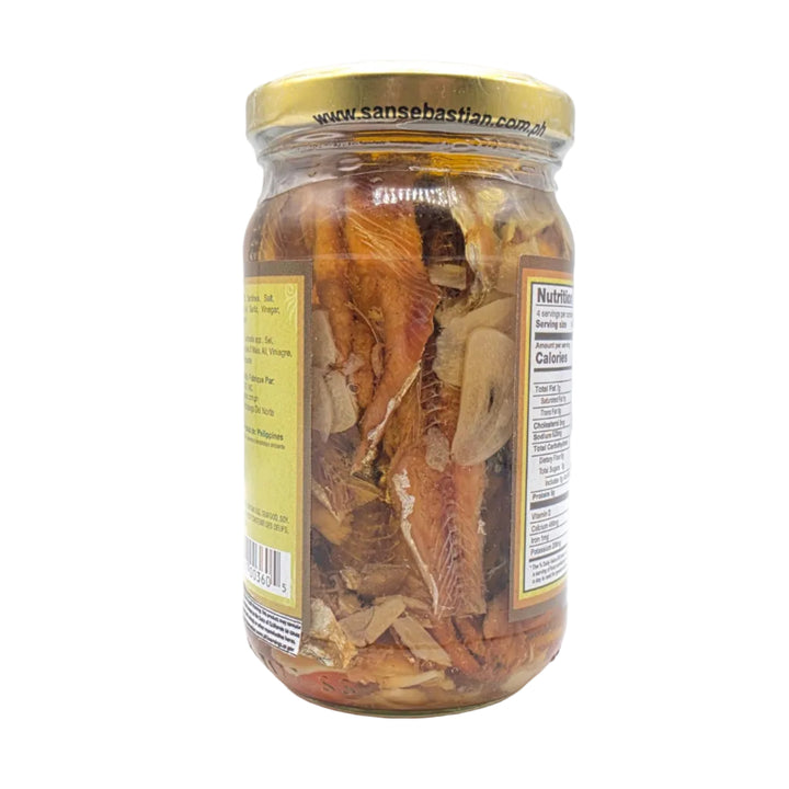 Jar of dried herbs on a white background