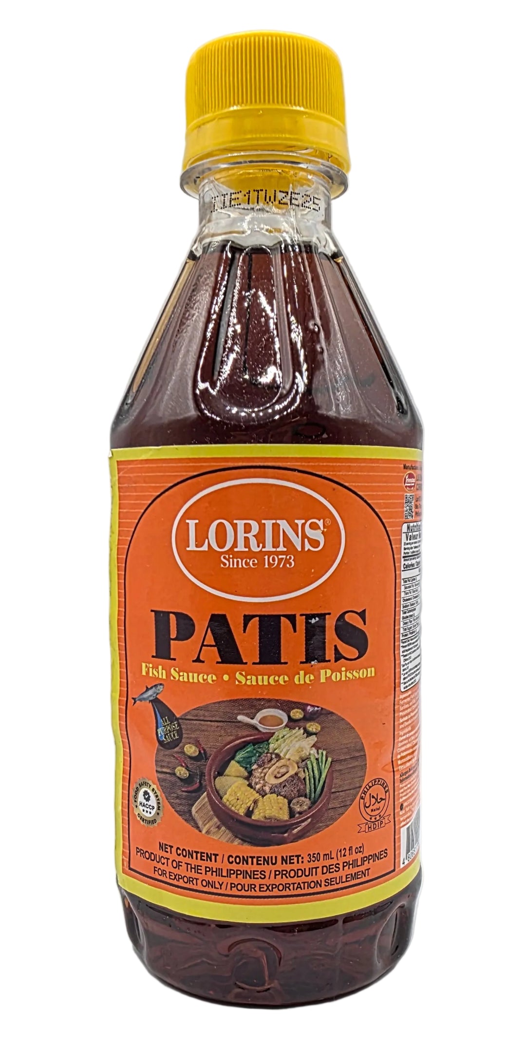 Bottle of Patiñs chocolate syrup with a yellow cap on a white background