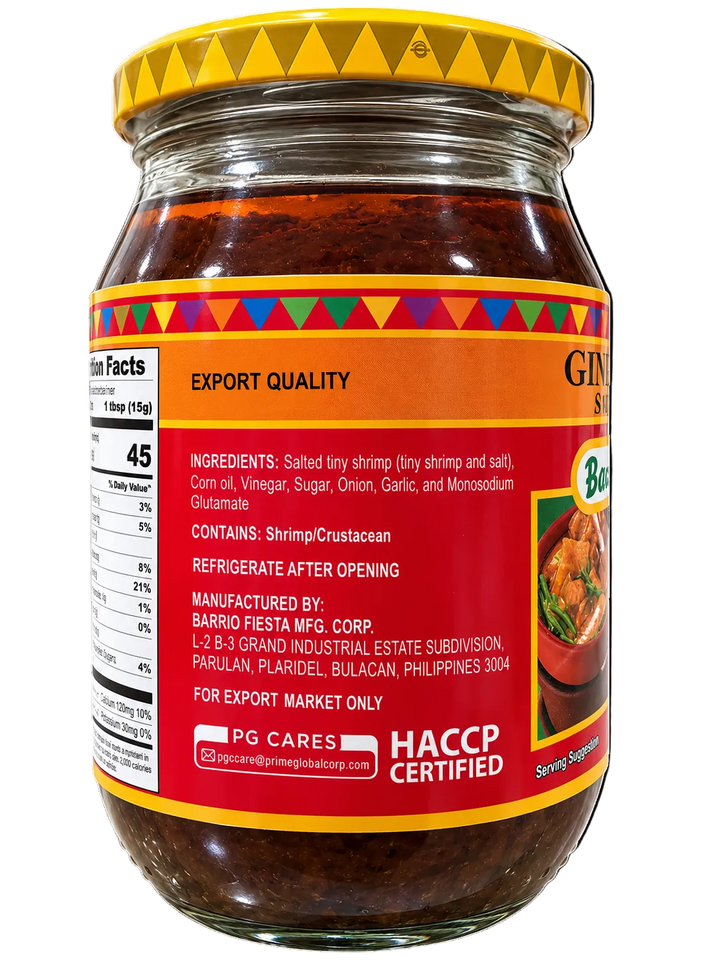 Back view of Barrio Fiesta Sweet Ginisang Bagoong (Sautéed Shrimp Paste) in a glass jar with yellow lid, featuring ingredients, allergen information, manufacturer details, and nutrition facts.