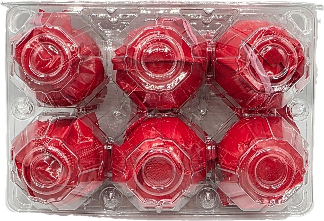 Six red roses in a clear plastic packaging tray