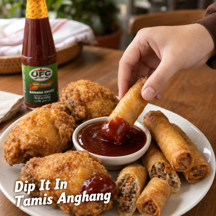 UFC Tamis Anghang Banana Sauce bottle with fried chicken and lumpia, hand dipping lumpia into the sauce, Dip It In Tamis Anghang