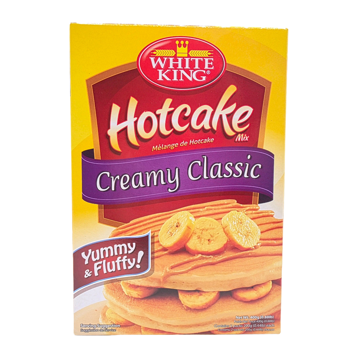 White King Hotcake Mix Creamy Classic box, featuring a yellow background with a red and purple logo banner and an image of banana pancakes on the front.